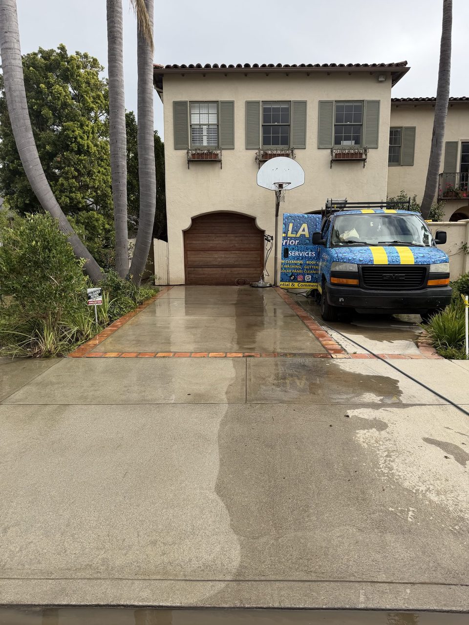 Gorilla Exterior Cleaning van at a freshly pressure-washed concrete driveway in Los Angeles